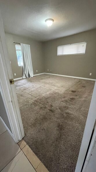 Bedroom. New carpeting will be installed before move-in date - 13947 Meadow Ln