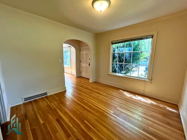 Building Photo - Charming 4 Bedroom Home with Hardwood Floors, Gas Fireplace & Large Fenced Yard