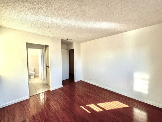 Building Photo - 2 Bedroom, 2 Bath Upstairs Condo with Private Balcony & 2-Car Garage, Gated Community, Water/Tras...