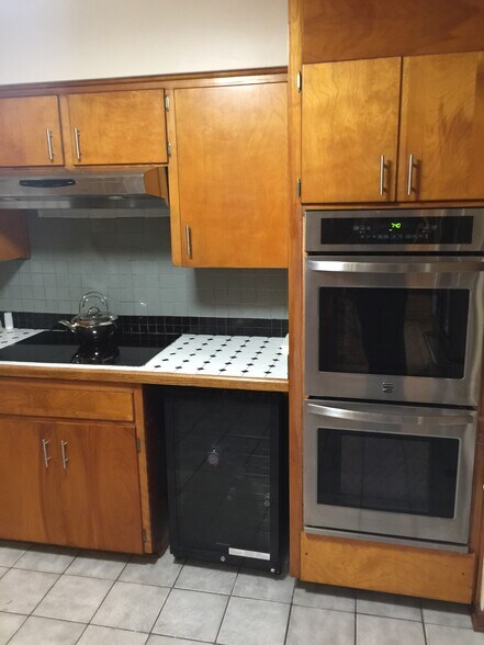 Stove top, oven, microwave, and wine fridge - 2842 SW 1 Ave