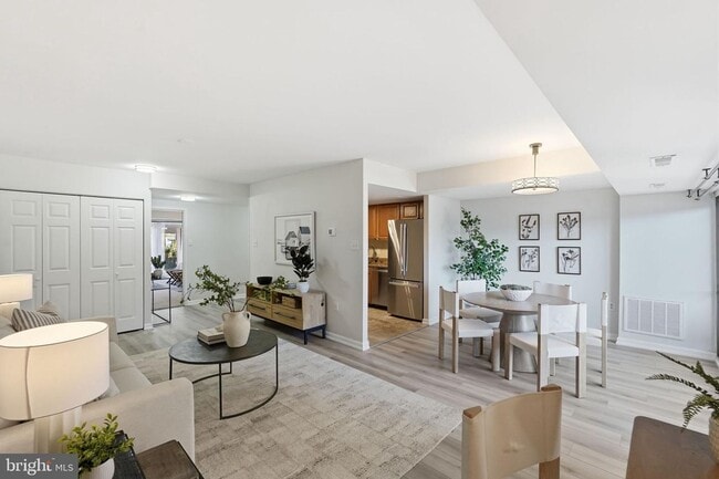 Building Photo - Welcome to this rarely available and beautifully updated ground-level condo offering the perfect ...