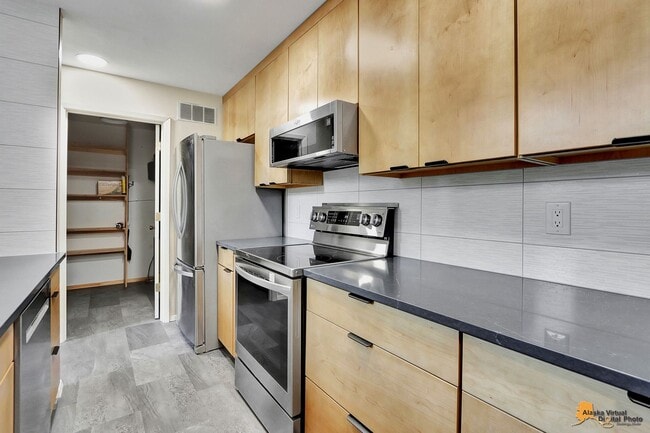 Building Photo - Spacious and bright condo located in a quiet area that boasts the perfect combination of style an...