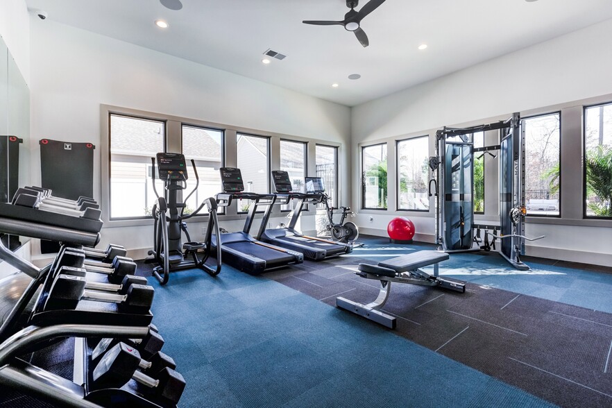 Club-quality fitness studio with cardio equipment. This image is a representation of the fitness studio at Amavi Brier Creek and is tentatively scheduled to open Summer 2025. - Amavi Brier Creek