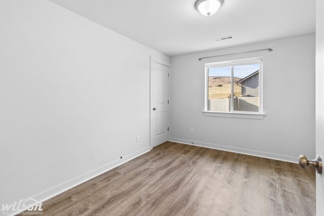 Building Photo - Welcome Home: Big Yard, Garage, and Pets A...