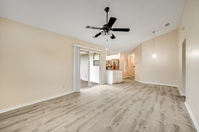 Building Photo - Spacious 3/2 with split plan and large fenced yard!