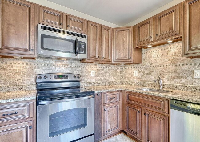 Building Photo - Updated End-of-Group Townhome with Finished Lower Level, Fenced Yard & Community Pool