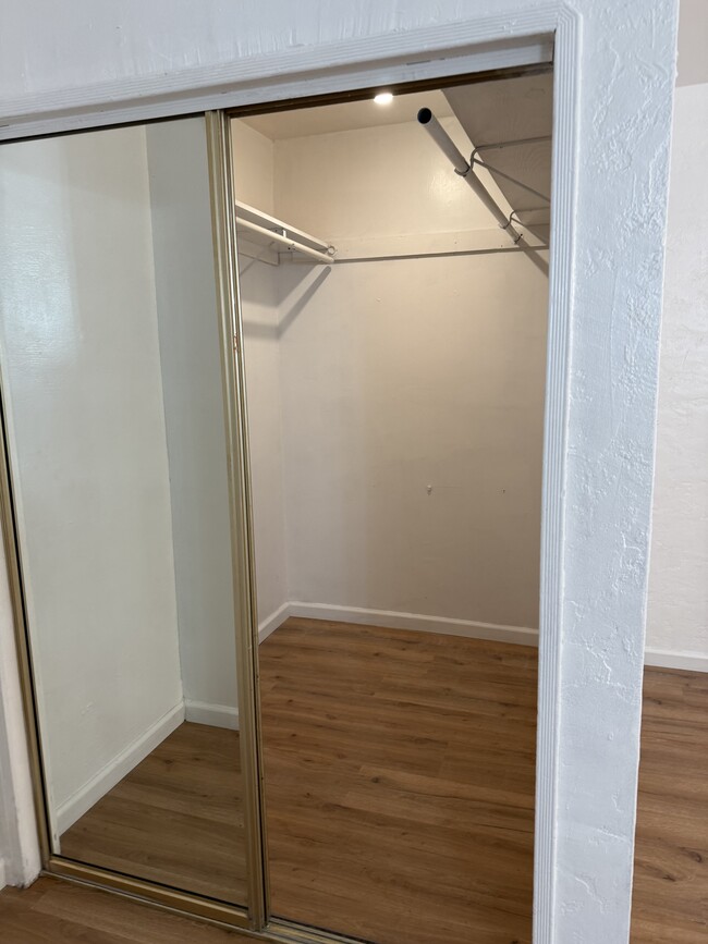 Mirror doors to closet of master room - 112 E 69th Way