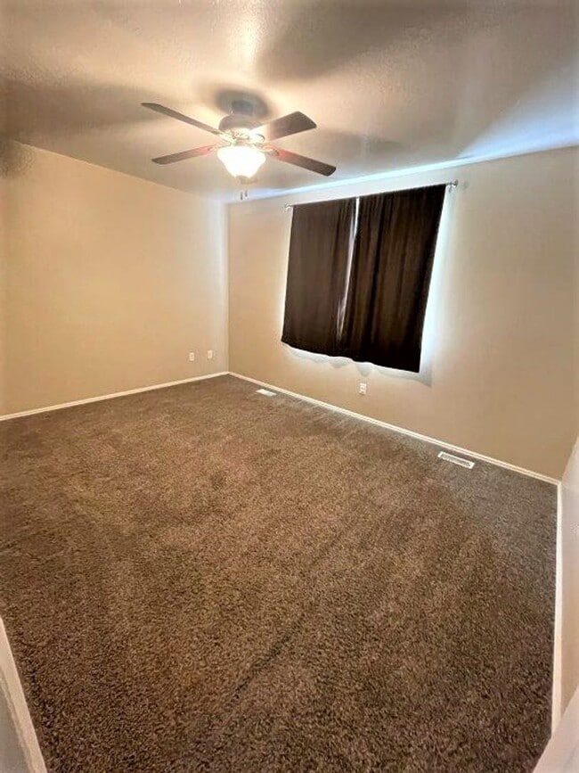Building Photo - Move-In Ready 5-Bed with Garage, Yard & Up...