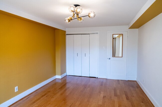 Building Photo - $750 Move-in Credit! Bright and Peaceful One-Bedroom with Built-Ins and Rooftop Views