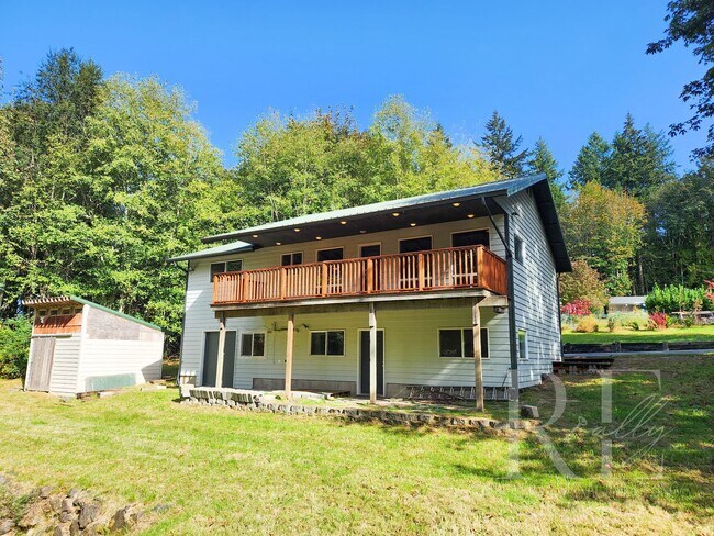 Building Photo - Vaulted Ceilings, Unique Designer Kitchen & Expansive Half-Acre Setting with Flexible Living Spaces