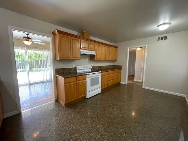 Building Photo - Single Story 3 Bedroom, 2 Bath Single Story Home with Huge Backyard!