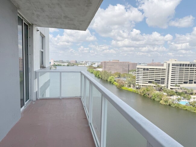 Building Photo - Rare 2/2 Corner Penthouse with Panoramic Lagoon Views from Every Room – Available Now!