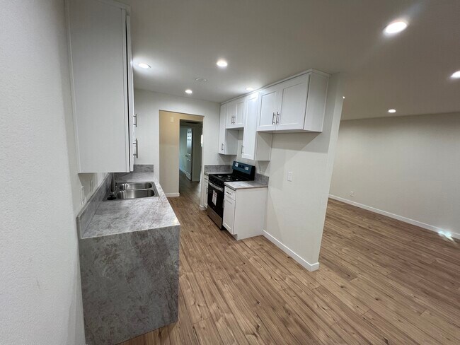 Kitchen from dining room - 7439 Woodman Ave