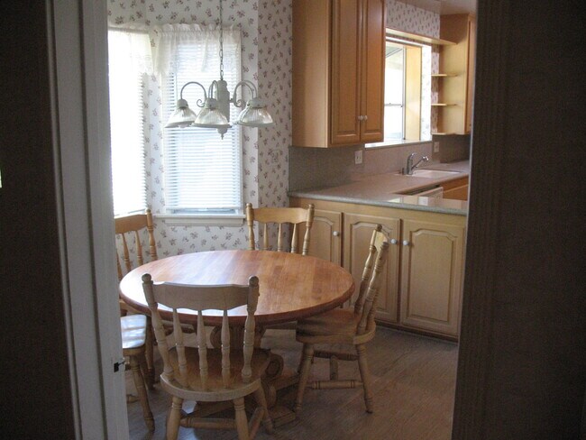 Natural wood kitchen table with wooden chairs - 3121 W Wyoming Ave