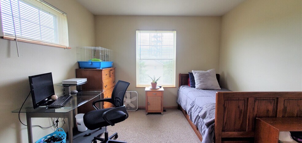 Bedroom 1/upper level. (photo from neighboring unit with the same layout) - 1756 St Joseph St
