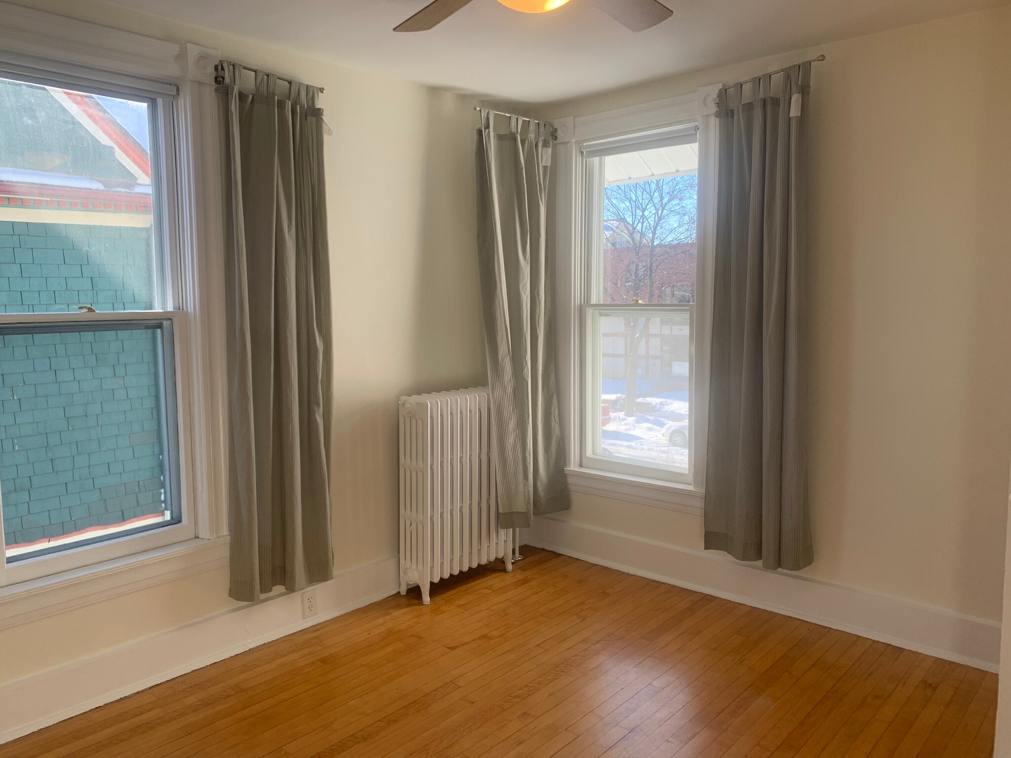 Bedroom or living area 1 - vintage hardwood floors, freshly painted - 2645 Colfax Ave S