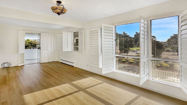 Building Photo - Exceptional Corner Unit w/ Wraparound Sout...