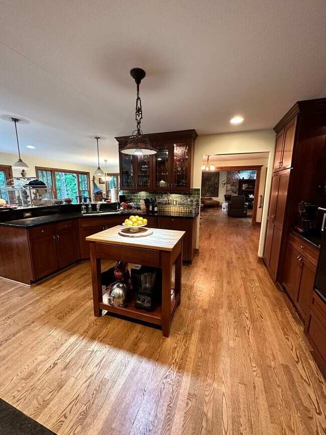 Building Photo - Dream Home in Highland, Michigan: Your Private Oasis on 5 Wooded Acres