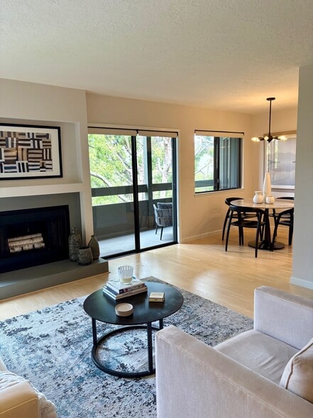 Fireplace, balcony & dining area - 820 Sea Spray Ln