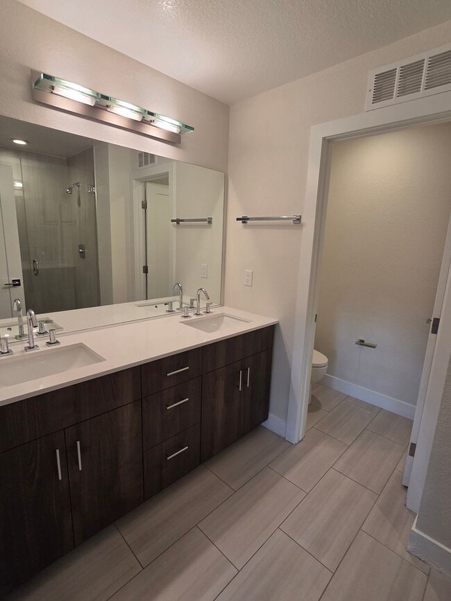 Building Photo - STUNNING 4-LEVEL TOWNHOME IN HIGHLANDS WITH SAUNA, 2-CAR GARAGE + AMAZING ROOFTOP DECK!