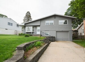 Building Photo - Beautiful multi-level with Gorgeous Yard and LOTS of Storage!