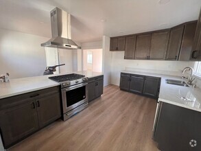 Building Photo - FULLY REMODELED 2BR/1BA home w/ parking an...