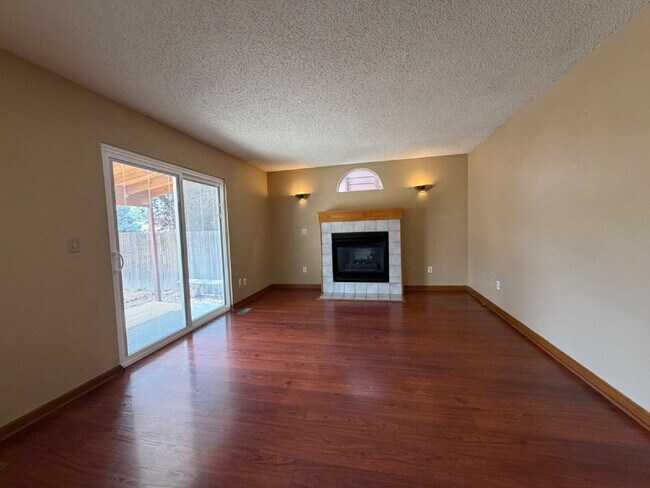 Building Photo - ~Available Now~  Beautiful Four Bedroom Home with Fireplace, Private Yard & Luxurious Primary Suite!