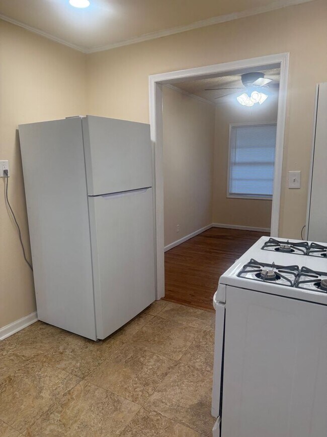 Building Photo - Step into this beautifully updated 1950's gem, where charm meets modern convenience