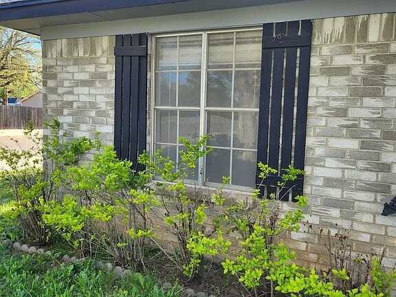 The house has roses around all the front windows - 1301 La Paloma St