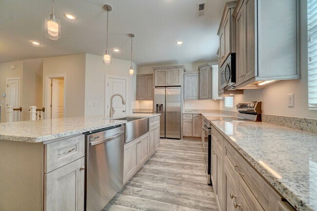 Building Photo - Available 08-05-25! Coastal Luxury Townhom...