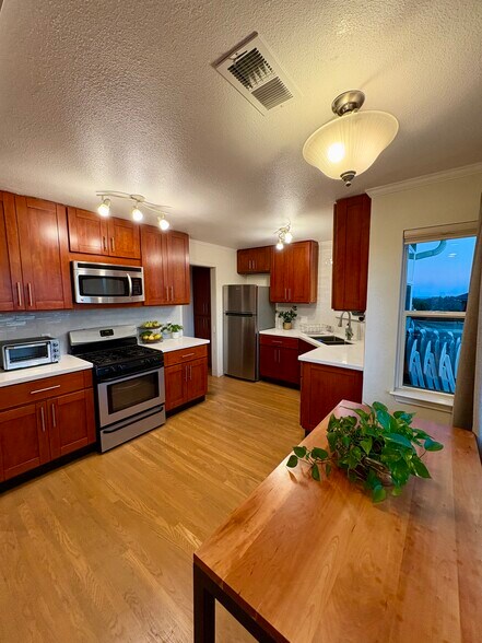 kitchen with brand new countertops and subway tile - 7872 Michigan Ave