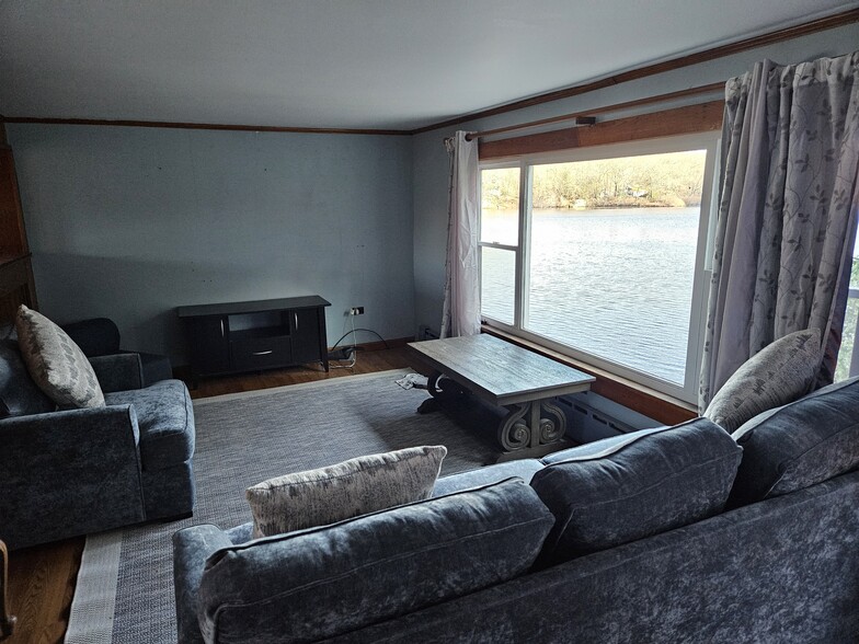 Living room with lake view - 66 Long Pond Rd S