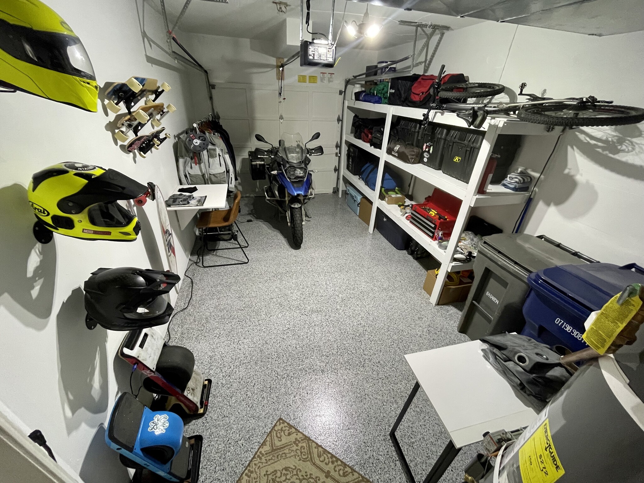 Painted garage with Floor Shield floor coating and extensive shelving. - 1131 115th St SW