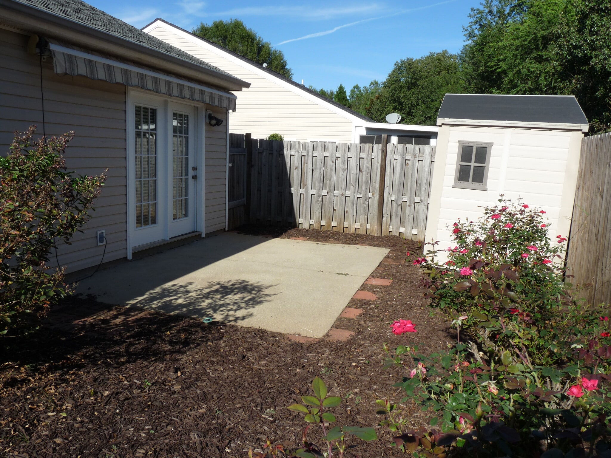 Back yard with storage shed. - 136 Portofino Ln SW