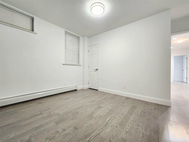 Building Photo - 76-12 Woodside Ave