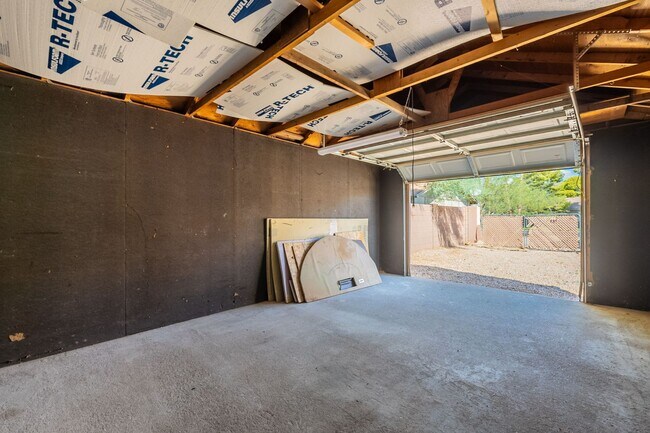 Building Photo - Three bedrooms plus big garage!