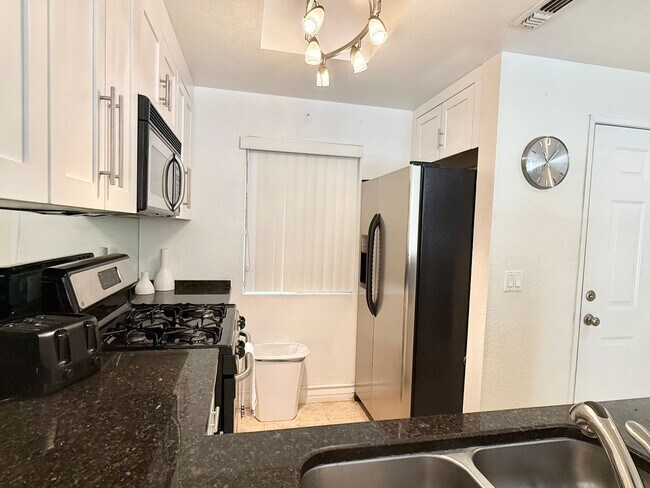 Building Photo - Meridian - Luxury STUDIO Condo w/ laminate Flooring. Pool View in Resort Style Community.