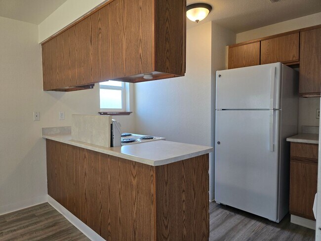 Building Photo - Upper Floor 2 Bedroom with Carport