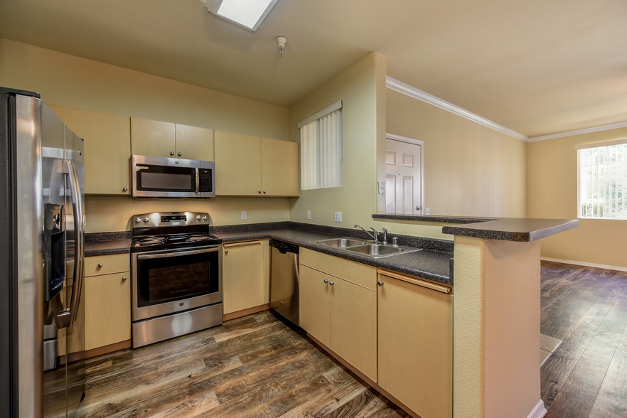 Modern Kitchen Interiors w/ Stainless Steel Appliances - Broadstone at Stanford Ranch