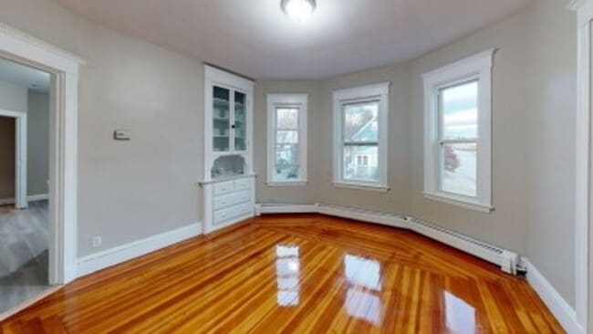 Building Photo - Renovated 6BR with In-Unit Laundry, 3 Parking Spaces & Commuter Rail Access