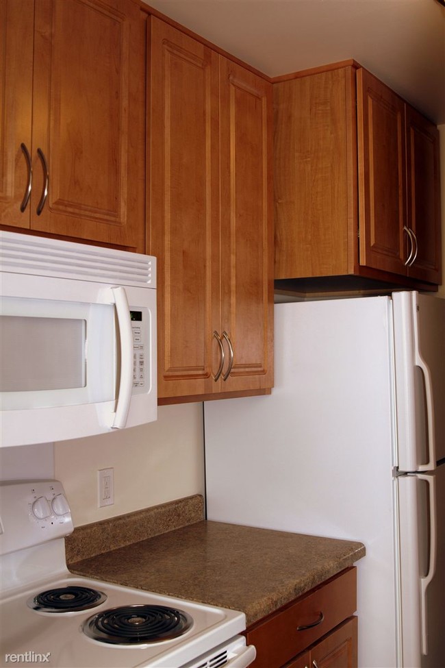 Extra large cabinet over refrigerator. - Cherry Hill Manor Apartments