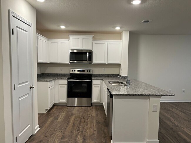 Building Photo - Beautiful New Construction 3 bedroom 2.5 Condo   with garage- Water, trash & sewer incuded!