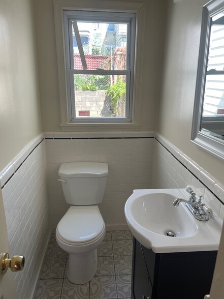 first floor half bath - 3044 Amber St
