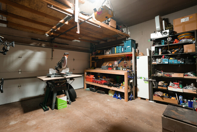 Garage. Perfect space for fabrication shop, storage, or to park your car. Has woodstove - 2507 3rd St NE