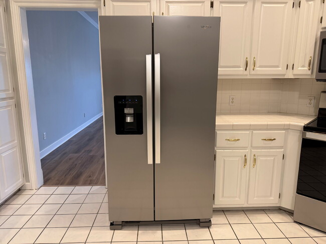 Building Photo - Elegant, Low Maintenance Townhome Designed for Elevated Everyday Living!