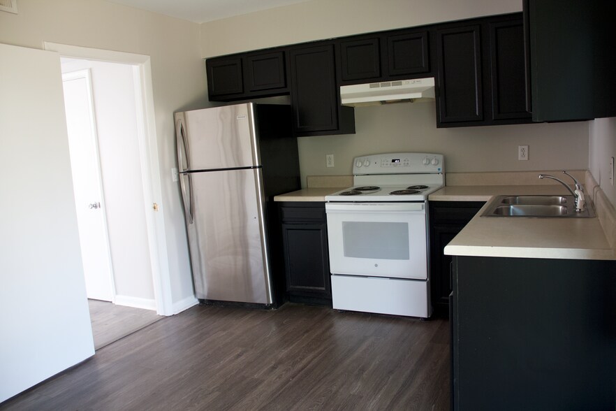 Large kitchen with new fridge and freshly painted cabinets - 3122 Brickdale Ln