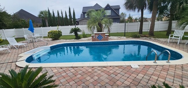 Building Photo - “Elegant 5-Bed Executive Home with Pool – ...