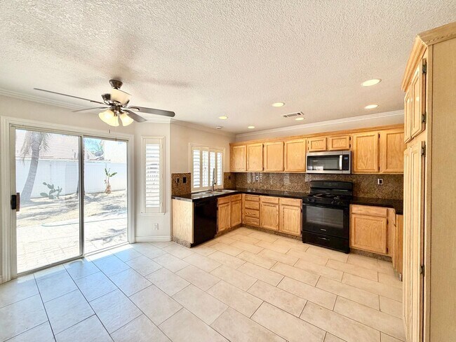 Building Photo - Open-Concept 3 Bedroom 2.5 Bathroom Home with Soaring Ceilings & Spacious Backyard