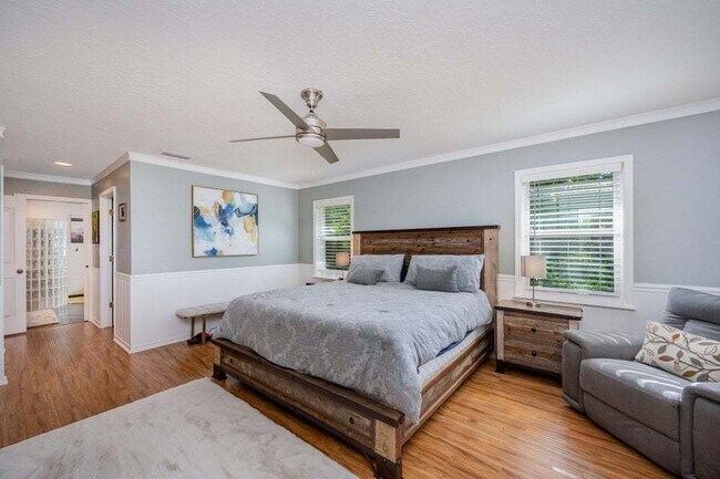 Building Photo - Luxurious 4 Bed/2.5 Bath Home with Stunning Lake and Golf Course Views with Pool on Savannahs Tra...