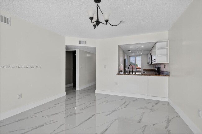 Building Photo - 9915 W Okeechobee Rd